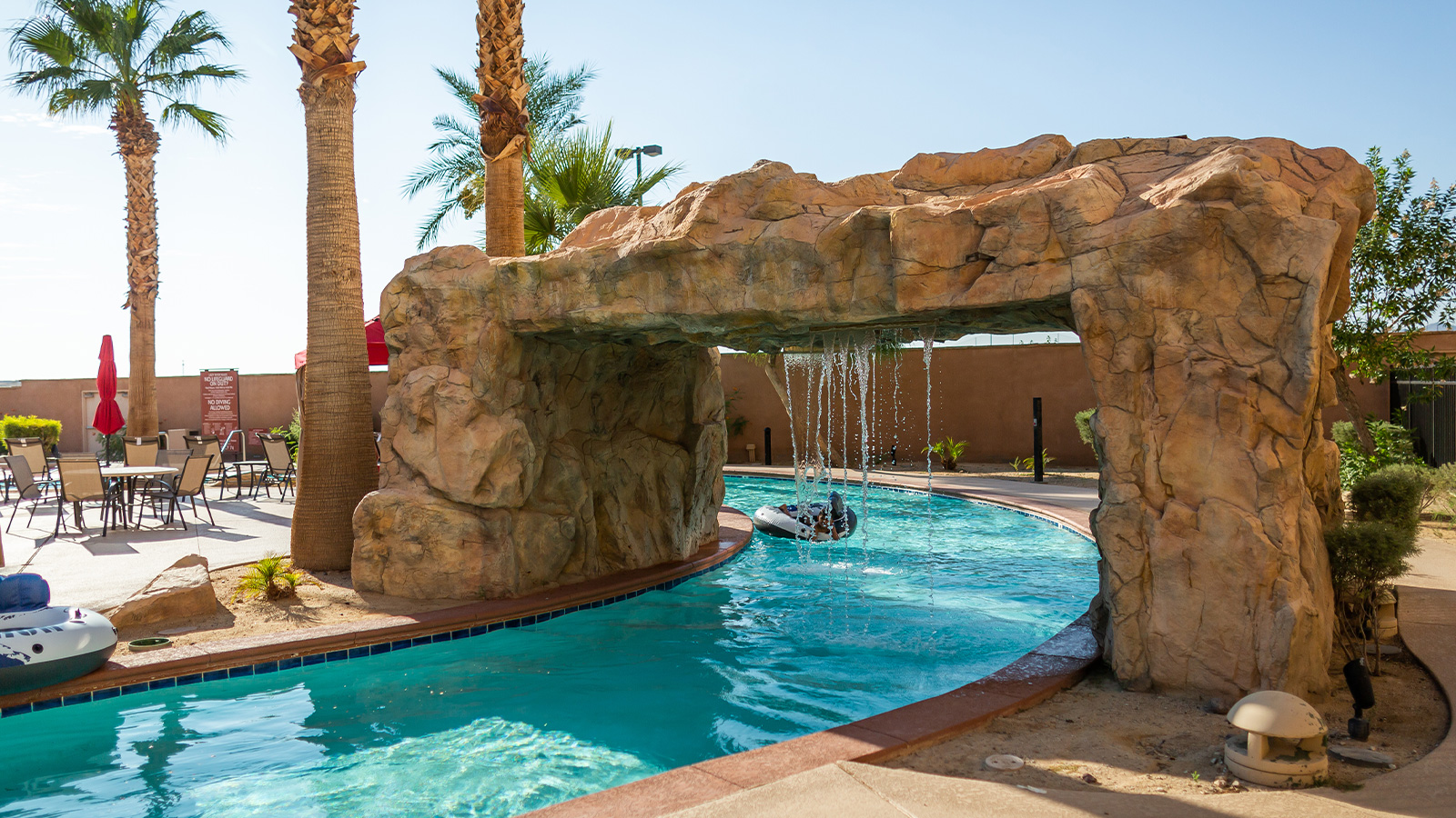 Hotel pool waterfall archway